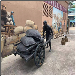 仿銅創(chuàng  )意推車(chē)人物銅雕塑